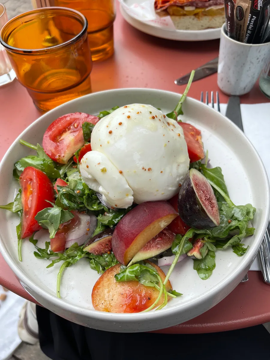 Burrata salad with colourful tomatoes, figs and leaves
